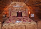 Queen size bed in the open loft